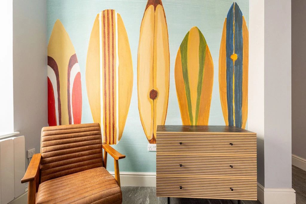 Beach terrace mural showing painted surf boards