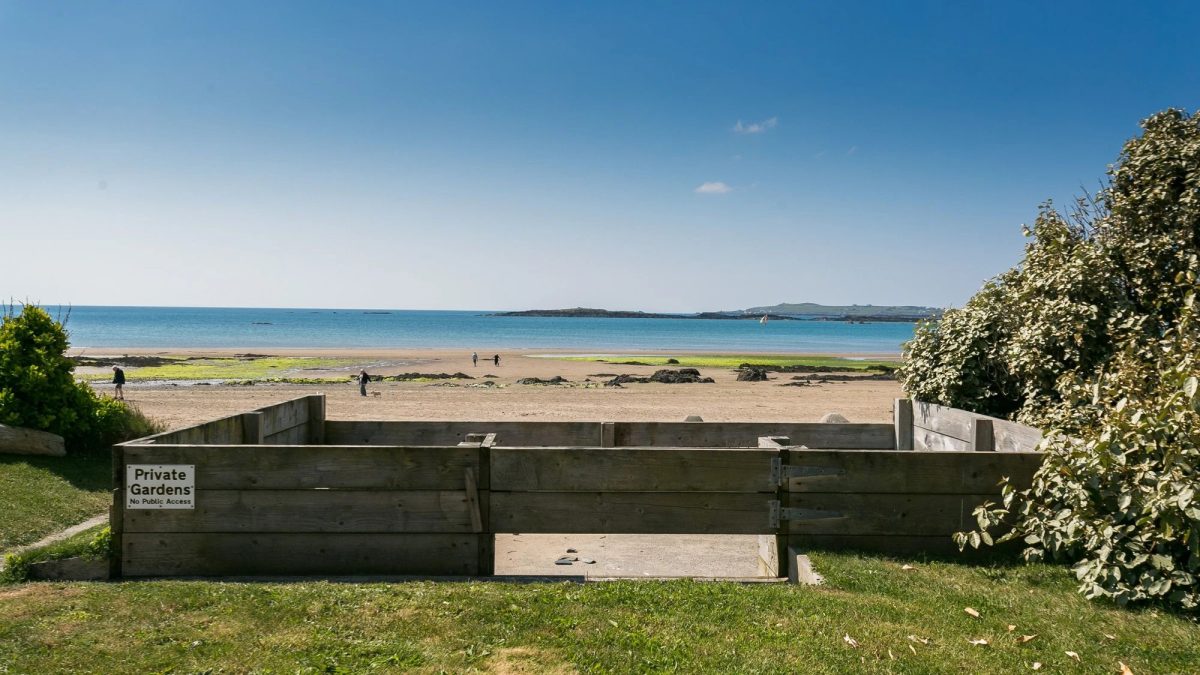 Beach terrace garden onto the beach with the sea in the background